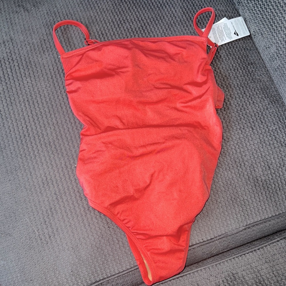 NWT Coral one piece bathing suit, cut out back. Size M fits like a Small